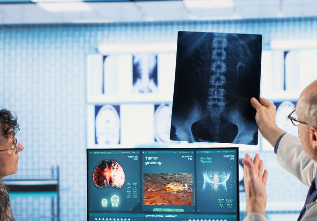 oncology-consultation-takes-place-as-senior-medic-explains-radiology-scan (1).jpg
